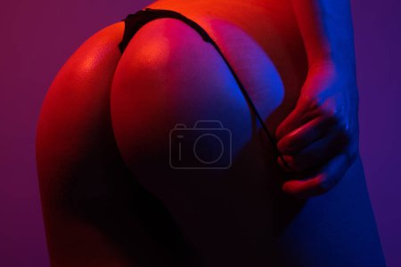 Photo for Sexy buttocks in erotic lingerie. Putting panties off, panties down, undress lingerie, thong bikini. Sexy woman body in bikini stripper. Huge buttocks. Fit slim sexy booty woman back. Sexy models butt - Royalty Free Image