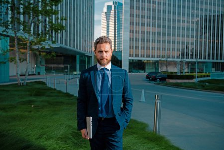 Photo for Businessman with success business. Outdoors portrait male model in suit - Royalty Free Image