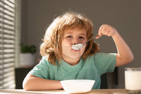 Photo for Funny kid with plate of soup. Child dinner - Royalty Free Image