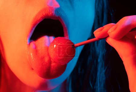 Photo for Close up lips with lollipop isolated, sexy blowjob, sensual mouth with lipstick eats sweets. Sexy design for women and girls. Beautiful lips - Royalty Free Image