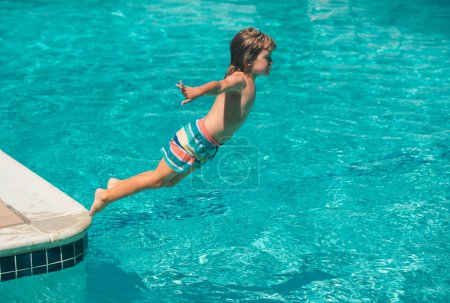 Photo for Kid at aquapark. Child jumping into water on summer vacation. Swimming on summer camp - Royalty Free Image