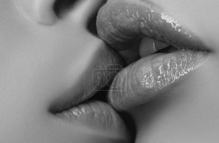 Lesbian Lgbt couple kiss. Sensual kissing. Female lips close-up. Love and feelings. Homosexual concept. Gentle tongue in the female mouth