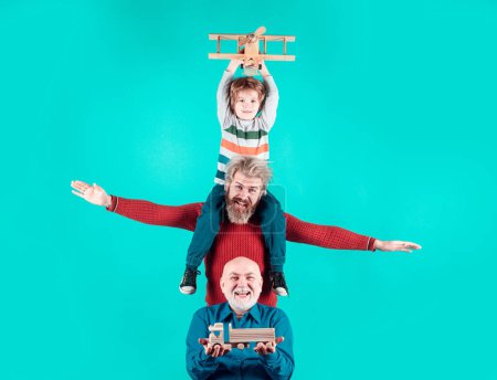 Photo for Grandfather father and grandson are hugging looking at camera and smiling. Fathers day concept. Men in different ages isolated background - Royalty Free Image