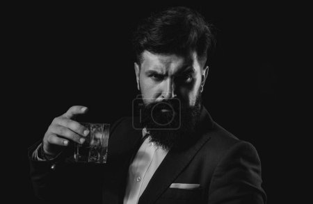 Photo for Cheerful bearded man is drinking expensive whisky. Fashionable man in white shirt and suspenders - Royalty Free Image