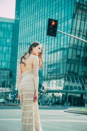 Photo for City life. Woman in modern town. Fashion street style vogue. Fashionable girl walking on streets - Royalty Free Image