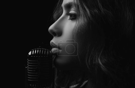 Photo for Closeup woman with retro microphone. Karaoke girl singer. Concert, sing - Royalty Free Image