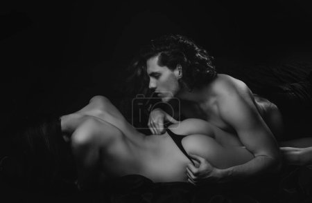 Photo for Sexy couple play in love games. Sensual woman in erotic lingerie lie under muscular man. Sexy elegant couple in the tender passion. Portrait of a young couple. Valentines day - Royalty Free Image