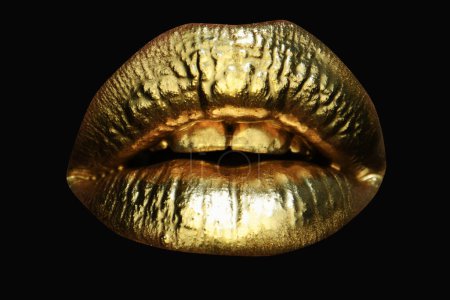 Photo for Golden lipstick on lips, female gold mouth. Imprint lips. Luxury cosmetics for women. Golden effect on the lips - Royalty Free Image