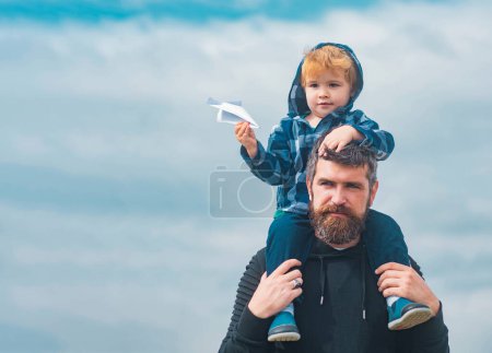 Photo for Father and son. Cute boy with dad playing outdoor. Funny time. Imagination. Daddy and child son - Royalty Free Image