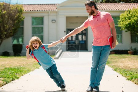 Photo for Amazed school boy going to school with father - Royalty Free Image