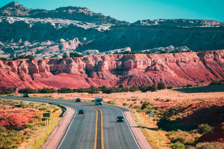 Asphalt highway and hill landscape under the blue sky. Curved Arizona Desert Road