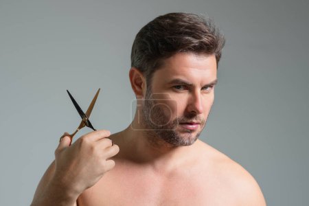 Photo for Caucasian man trying to make a hair cut by himself with scissors. Male haircut. Barber scissors, barber shop. Barber scissors. Cutting hair concept. Mens hair style and hair cut - Royalty Free Image