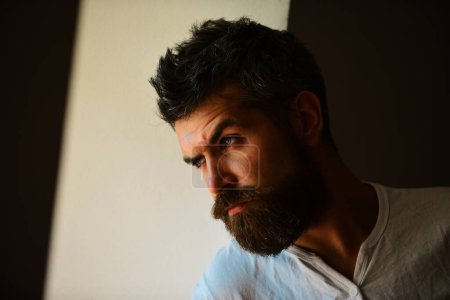Photo for Brutal man, serious face of handsome male model, concept of men power and strong. Shadow male face. Close up portrait of guy with serious profile face - Royalty Free Image