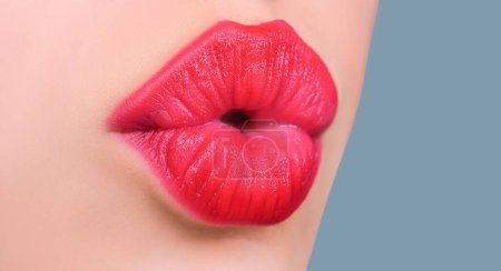 Photo for Girl kissing. Female lips kiss. Natural beauty lip care. Sexy female lips with pink lipstick. Sensual womens open mouths. Red lip with glossy lipgloss. Tongue and sexy - Royalty Free Image