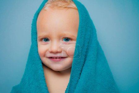 Photo for Purity and hygiene education. Child in clean and dry towel. Happy bath time. Image of cute baby boy covered with towel isolated - Royalty Free Image