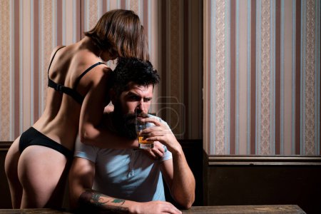 Married couple, sexual problems and alcohol addiction concept. Foreplay and love games of sexy couple