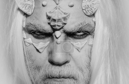 Photo for Viking with a horned head. Demon head isolated on black. Demon with bloody horns on head. Man evil with horns. Vampire man with white eyes. Man with a bull head - Royalty Free Image