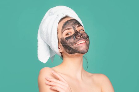 Photo for Woman spa mask, beauty concept healthy portrait. Mud facial mask, face clay mask spa. Beautiful woman with cosmetic mud facial procedure, spa health concept. Skin care beauty treatment. Towel on head - Royalty Free Image