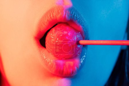 Photo for Sucking lips. Lips with candy, sexy sweet dreams. Female mouth licks chupa chups, sucks lollipop - Royalty Free Image