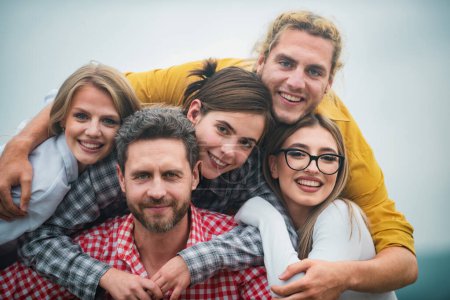 Photo for Group of happy people. Youth and friendship concept. Group of friends laughing outdoor, sharing good and positive mood - Royalty Free Image