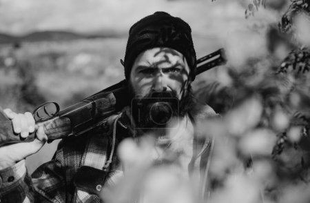 Photo for Hunter with shotgun gun on hunt. Man holding shotgun - Royalty Free Image