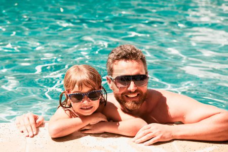 Photo for Father and son swimming in pool, summer family. Happy family at pool - Royalty Free Image