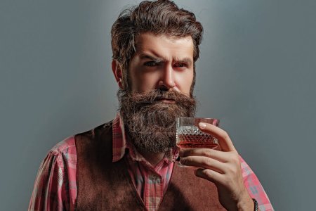 Photo for Serious unhappy sad man pouring vodka while having alcohol addiction. Confident well-dressed man with glass of whisky - Royalty Free Image