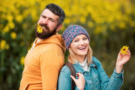 Photo for Fashion autumn portrait woman and man with yellow maple leaves on nature background. Autumn and leaf fall Dreams. Hello Autumn. Autumn love story - portrait couple in love - Royalty Free Image
