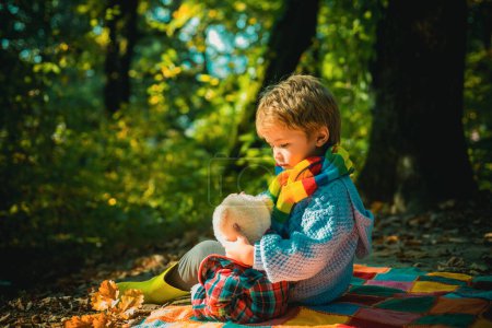 Photo for I will show you beauty of nature. Inseparable with toy. Boy cute child play with teddy bear forest background. Child took favorite toy to nature. Picnic with teddy bear. Hiking with favorite toy. - Royalty Free Image
