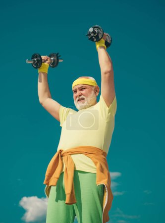 Photo for Elderly man workout. Senior sportman lifting dumbbells - Royalty Free Image