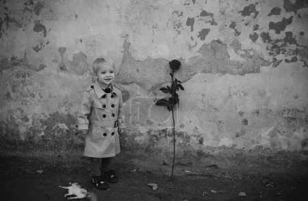 Photo for Valentines day. romantic date. small kid with red rose. happy childhood. love present. childrens day. little boy in vintage coat - Royalty Free Image