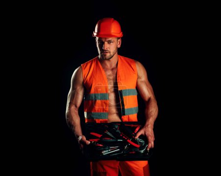Foto de Hombre constructor en ropa de trabajo, reparador profesional. Trabajador de servicios - Imagen libre de derechos