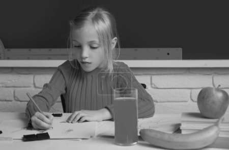 Photo for Cute little child studying in classroom at elementary school. Genius child, knowledge day. Kids education and knowledge - Royalty Free Image