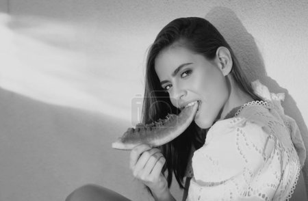 Photo for Portrait young woman is holding slice of watermelon - Royalty Free Image