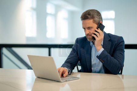 Photo for Business office interior. Businessman chatting phone online in office. Business man in suit using phone. Office worker solves cases on phone. Office manager talk phone. Ceo manager using smartphone - Royalty Free Image