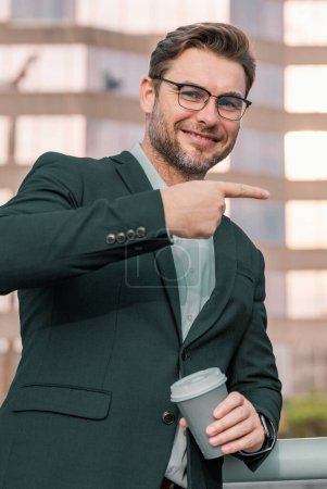 Photo for Businessman pointing finger. Business man outdoors city looking cityscape. Business man in suits outdoors. Middle aged hispanic business man on office building. Success business - Royalty Free Image