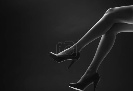 Photo for Woman legs in red heels. Fashion style. Girl sexy slim feet - Royalty Free Image