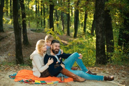 Photo for Happy Family Camping in the autumn Park. Active people concept. Outdoors. Autumn camping with kids, mother and father. Good family concept - Royalty Free Image