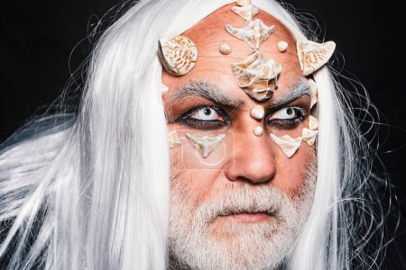 Photo for Monster with sharp thorns and warts on face. Ancient alchemy. Man wizard with fantastic make up on demon face. Magic and fairy tale concept. Devil horns. Wizard demon man with dragon skin and horns - Royalty Free Image