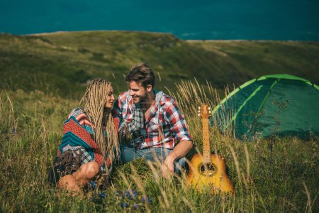 Photo for Romantic couple camp on holiday. Young couple in love hug each other. Love story - Royalty Free Image