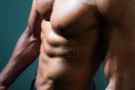 Photo for Cropped image of fit man showing six pack abs. Men abs. Fitness abdominal muscle. Man six pack - Royalty Free Image