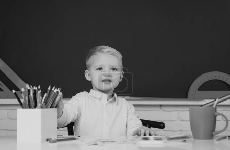 Photo for Educational process. Education. Kid gets ready for school. Chalkboard copy space. Learning and education concept - Royalty Free Image