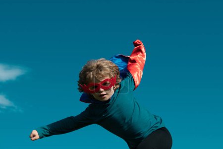 Photo for Excited child boy dressed like superhero. Super hero concept - Royalty Free Image