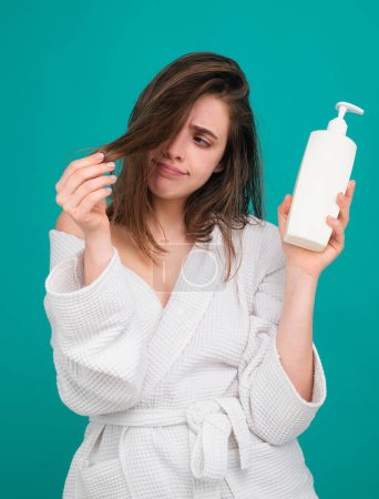 Photo for Woman hair loss problem for health haircare shampoo. Hairloss concept. Woman hold bottle shampoo and conditioner. Beauty product - Royalty Free Image