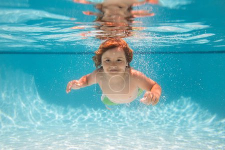 Photo for Beach sea and water fun. Young boy swim and dive underwater. Under water portrait in swim pool. Child boy diving into a swimming pool - Royalty Free Image