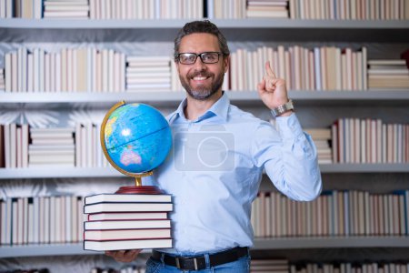Photo for Teachers day. Teacher in school classroom. Knowledge and education with middle aged teacher. Millennial teacher with book. Man teaching lesson in class. Teachers from university exam. College teacher - Royalty Free Image