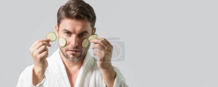 Photo for Banner of beauty man hold cucumber. Middle aged man with cucumber isolated on studio background. Cucumber for cosmetics skin mask. Facial mask with cucumber. Spa, dermatology and wellness - Royalty Free Image