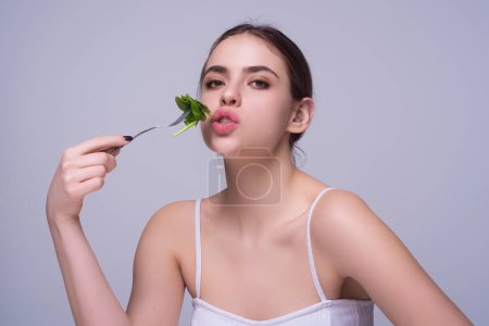 Photo for Diet plan, diet menu or program. Woman eat vegetable isolated on studio background. Weight loss detox diet. Healthy food and dieting concept. Low carb, vegan diet. Weight loss. Low calorie dieting - Royalty Free Image