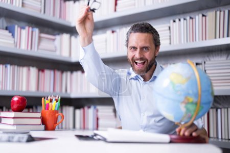 Photo for Teachers day. Teacher tutor in school classroom. Knowledge, education. Man with book teaching lesson in class. University exam. Study teach in college. Educator learning courses. Studying literature - Royalty Free Image