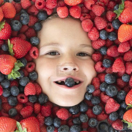 Photo for Funny fruits. Mix of strawberry, blueberry, raspberry, blackberry background. Berries close up near kids face. Fresh berries, top view. Mix of raw fresh berries fruits - Royalty Free Image